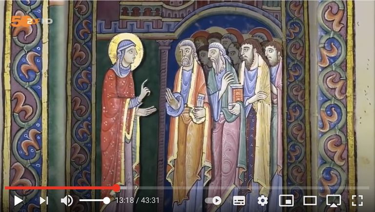 Medievalische Glasmalerei zeigt biblische Szene mit vier Figuren in farbenfroher Kleidung.